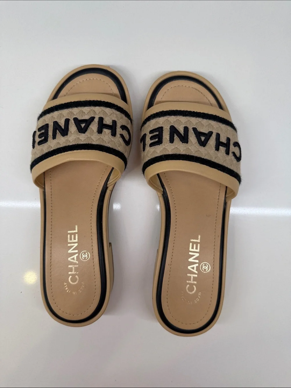 CHANEL Tan and Black Quilted Logo Slide Mules